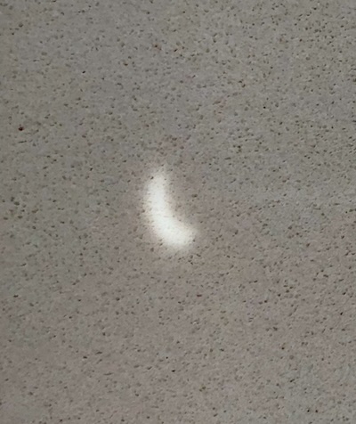 Pinhole projection of eclipse on my kitchen countertop.