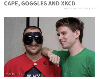 Cory Doctorow (in red cape & goggles) with Randall Munroe of XKCD, at 3PiCon in 2008.