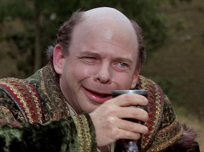 Actor Wallace Shawn playing the dangerous idiot Vizzini in _The Princess Bride_, in the iocaine scene