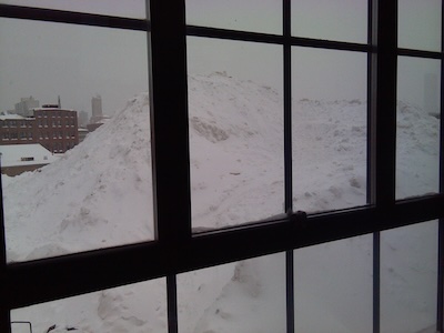 View from a 3rd story lab window, looking UP at the top of the snow pile, where earth moving equipment was working